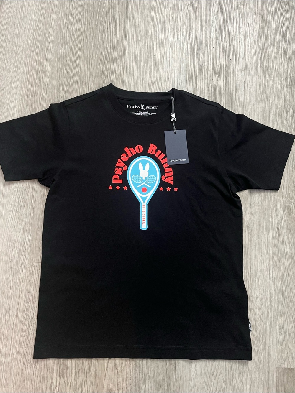 190–NWT Psycho Bunny Black Tee with Red & Light Blue Tennis Graphic